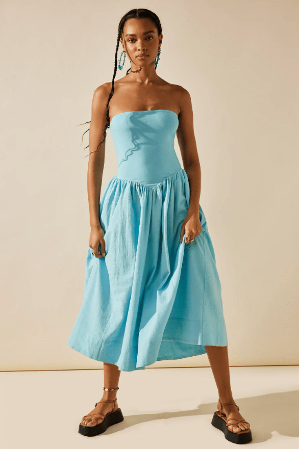 Female wears blue strapless dress with flats