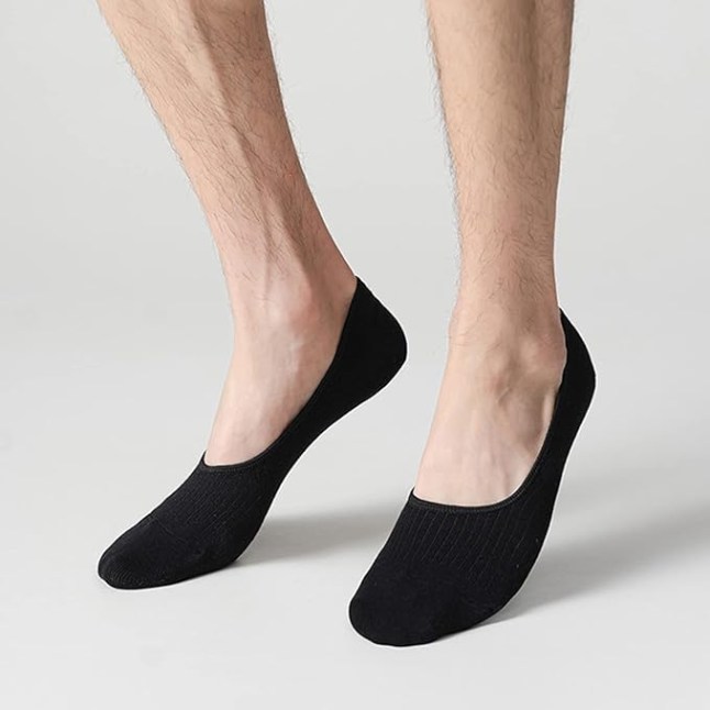 Pair of feet wearing black socks