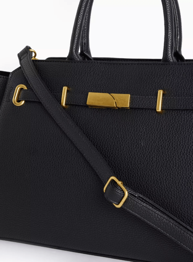 Black handbag with crossbody strap and handles